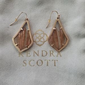 Kendra Scott earrings in gold and sand